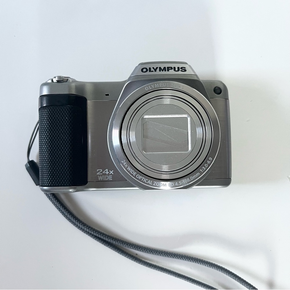 Olympus silver and black digital camera
